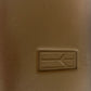 New OEM 1992-1993 Oldsmobile Cutlass Brown Steering Wheel Horn Pad, Part # 22565719
